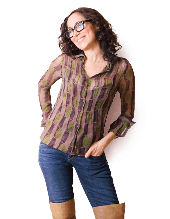 Karen with glasses standing with hand in pocket
